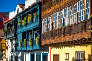 Wall Mural - Famous ancient colorful balconies decorated with flowers in Santa Cruz city on La Palma island in Spain