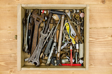 Black toolbox with different instruments. tool renovation on grunge wood. Tool Kit. Box with construction tools. Construction tools. Home and house renovation concept. set of tools in tool box