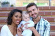© ajr_images - Happy interracial family is celebrating, laughing and having fun with Hispanic African American Mother, Caucasian father and ethnically ambiguous children son or daughter. Isolated on a staircase