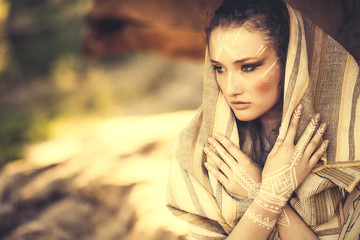 beautiful young woman standing in ancient dress