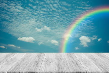 Blue sky cloud with Wood terrace and rainbow , process in vintag