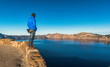 © checubus - scenic view of a man stand over look to Crater lake National park ,Oregon state,usa.