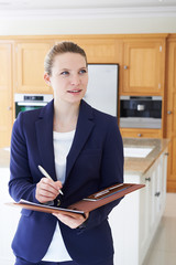 Wall Mural - Female Realtor Looking Around Vacant New Property