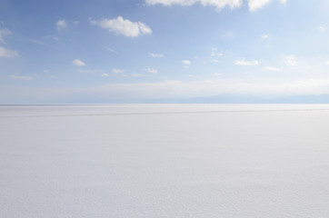 Smooth surface of snowy frozen Baikal