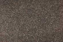 Explsed or exposed aggregate finish surface, red.