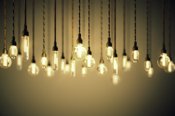 Poster - Bulbs with long filaments on brown background