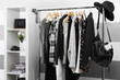 © Africa Studio - Female clothes on hangers in a room
