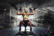 © Fotokvadrat - Professional sport fitness woman with weight disk in gym