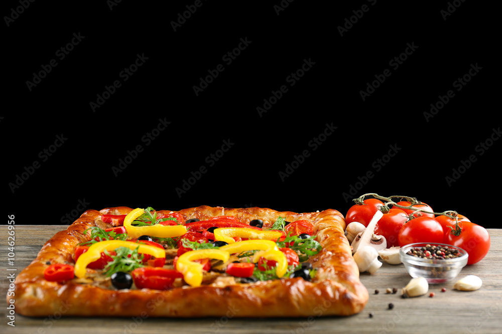 Freshly homemade pizza on black background