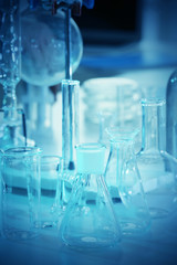 Wall Mural - laboratory glassware on table closeup