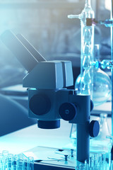 Wall Mural - microscope and different test tubes and flasks in laboratory