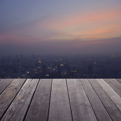 Wall Mural - Empty old wood floor with blurred aerial view of cityscape on wa