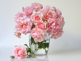 Bouquet of pink roses in a vase. Romantic floral still life with pink roses.