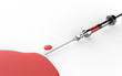 Syringe and red liquid isolated on white background
