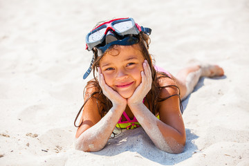 Happy girl enjoying sunny day at the beach