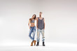 © konradbak - Sporty hip-hop couple isolated over the white background