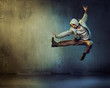 © konradbak - Athletic dancer in a jumping pose