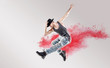 © konradbak - Conceptual picture of hip hop dancer among red dust