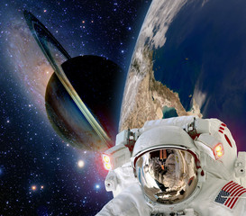 Wall Mural - astronaut helmet spaceman extraterrestrial saturn planet sci fi space travel. elements of this image