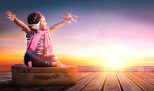 Dream Journey - Little Girl On Vintage Suitcase At Sunset 
