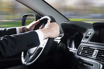  close up of young man driving car