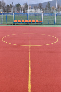 soccer field made from red granule rubber. football field backgr