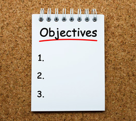 Poster - objectives on white paper notebook