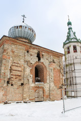 The ancient monastery church with a bell tower.