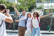 © WavebreakmediaMicro - Hip man taking picture of his friends