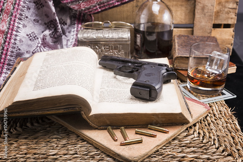 Set of ancient books , whiskey, casino dice and cards with handgun and bullets Poster