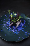 Fototapeta Desenie - Risotto with cuttlefish ink and black caviar