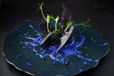 Fototapeta Desenie - Risotto with cuttlefish ink and black caviar