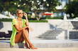 Pretty tanned woman outdoor fashion portrait
