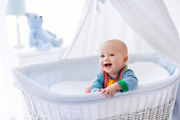 cute baby in white nursery