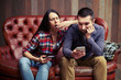 © ArtFamily - boring couple sitting on sofa
