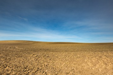 Early springtime plowed field landscape