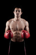 © halfbottle - Muscular Asian man with red boxing glove