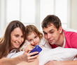 © Denys Kurbatov - smiling family making selfie home