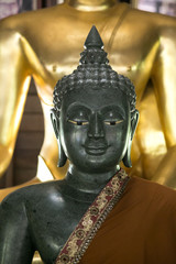Wall Mural - Black buddha statue made with black stone