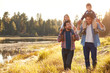 © Monkey Business - Gay Male Couple With Children Walking By Lake