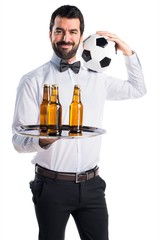 Wall Mural - Waiter with beer bottles on the tray holding a soccer ball