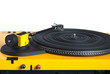 Turntable with black tonearm in yellow case with rubber mat on disc with stroboscope marks with output connectors rear view isolated on white background. Horizontal front view closeup