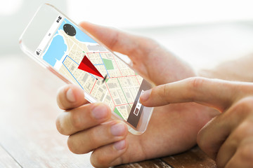 Poster - close up of hand with navigator map on smartphone