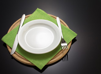 Poster - plate and fork with knife at napkin cloth on blac