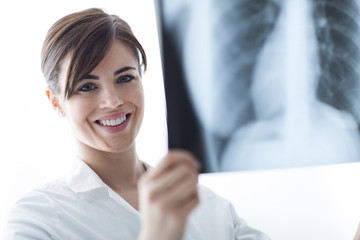 Wall Mural - Doctor examining a patient's x-ray