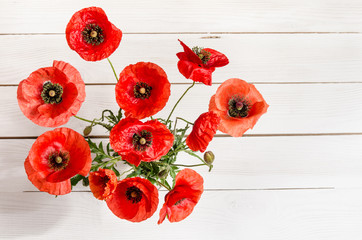 Wall Mural - beautiful red poppies on old white wooden table