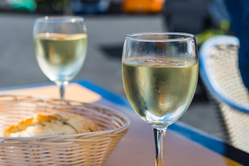 Appetizer with baguette bread and white wine for lunch