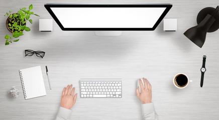 Leinwandbilder - Modern desk with isolated computer display top view. Designer works with a mouse and keyboard. Coffee, lamp, paper, glasses, plant, watch on table.