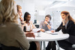 © NDABCREATIVITY - Business people meeting at  round table