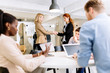 © NDABCREATIVITY - Business people shaking hands